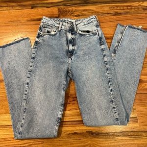 Zara straight leg high rise jeans with fringe bottom.